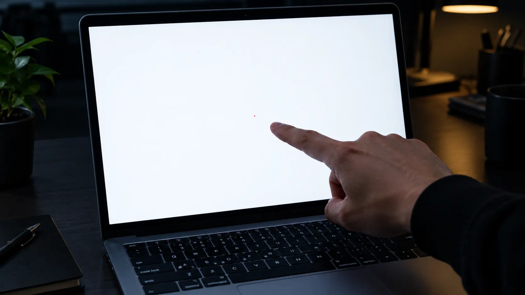 A laptop displaying a diagnostic test pattern on the screen