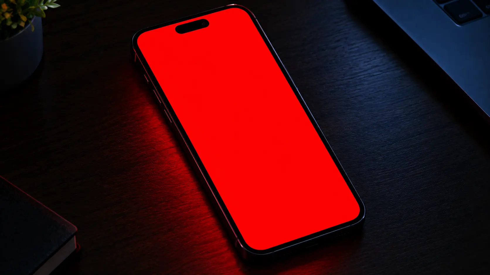 iPhone screen showing a solid red test screen to check for dead pixels